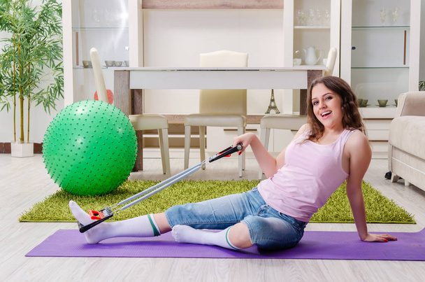 Young beautiful woman doing exercises at home  - Fotoğraf, Görsel
