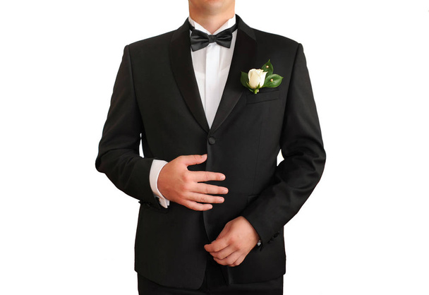 Man in a black suit on a white background - Foto, Bild