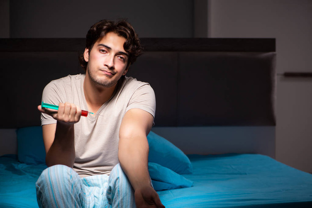 Sick man in his bed with medicines - Фото, изображение