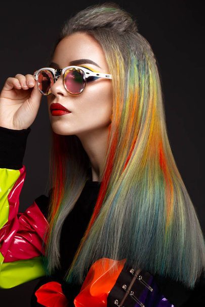 Beautiful girl with multi-colored hair and creative make-up and hairstyle. Beauty face. - Foto, imagen