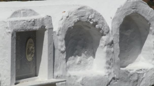 Niches and whitewashed white tombs in the round cemetery in Sayalonga - Footage, Video