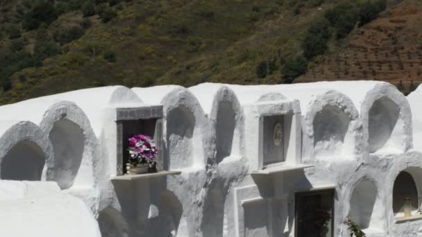 Niches and whitewashed white tombs in the round andalusian cemetery in Sayalonga - Footage, Video