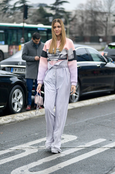 A trendy woman poses for street snaps during the Paris Fashion Week Womenswear Fall/Winter 2019/2020 street snap in Paris, France, 1 March 2019.  - Zdjęcie, obraz