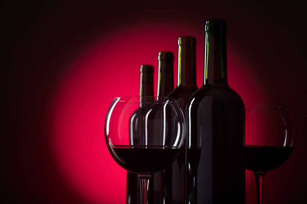 Glasses and bottles of red wine. - Φωτογραφία, εικόνα