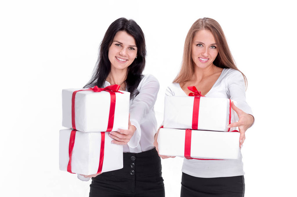 two young women with gift boxes. isolated on white - Zdjęcie, obraz