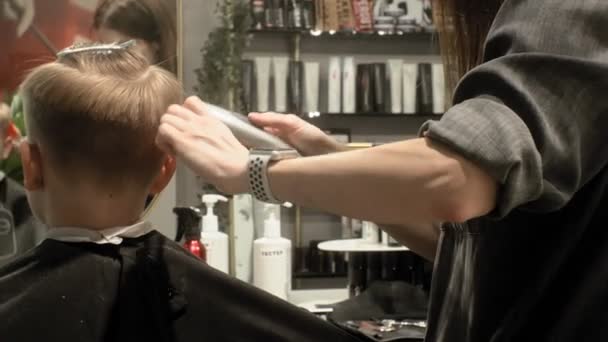 hairdresser, childrens and mens haircuts - Felvétel, videó
