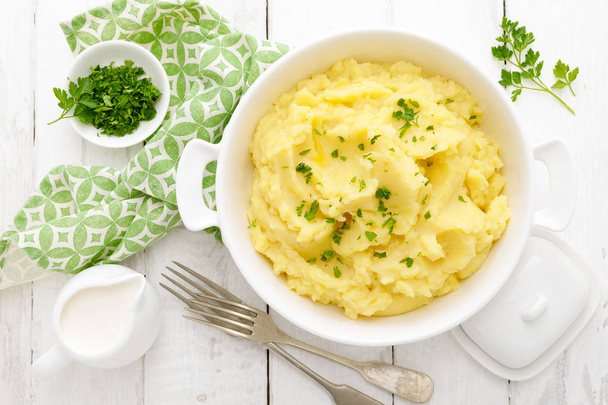 Mashed potato with butter and milk on table - Foto, Bild