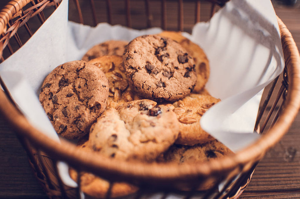 Close up chocolate chip cookies on wood table - 写真・画像