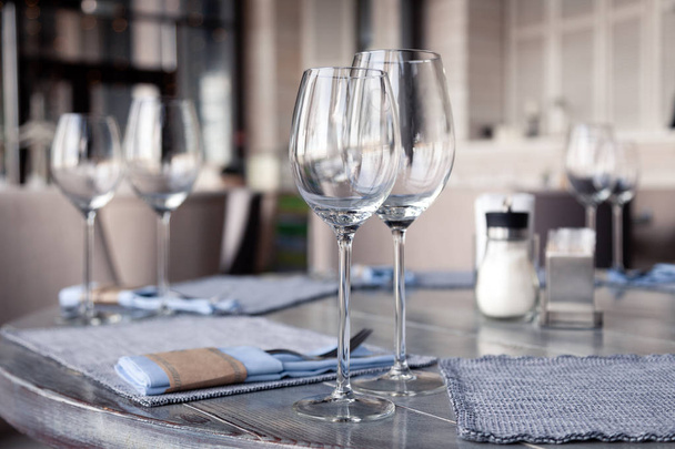 Restaurant interior, modern setting, wine and water glasses, for - 写真・画像