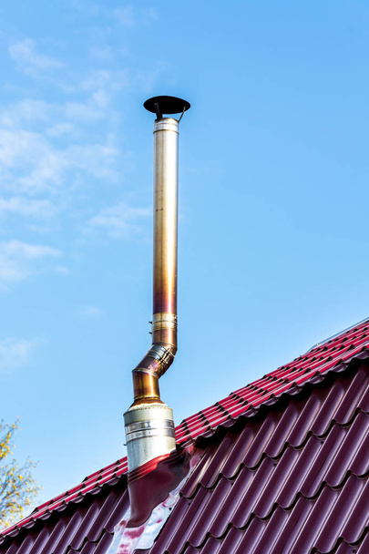 Iron pipe on the roof. - Φωτογραφία, εικόνα