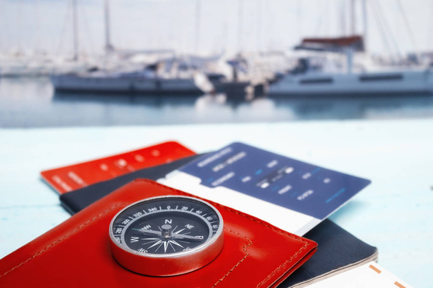 Time to Travel. Idea for tourism with passport, tickets and compass on the background of the sea and yacht. Concept on the theme of flights. - Φωτογραφία, εικόνα