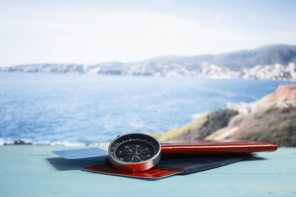 Time to Travel. Idea for tourism with passport, tickets and compass on the background of the beach and palm. Concept on the theme of flights. - Fotoğraf, Görsel