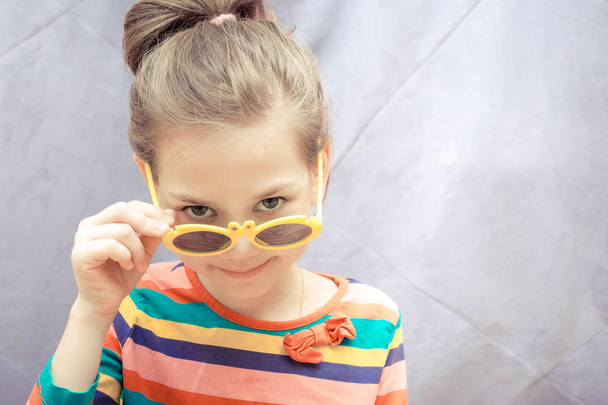 Young girl in sunglasses - Photo, image