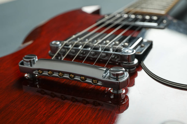 Beautiful six - string electric guitar on dark background, close - Photo, Image