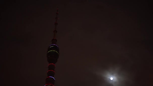 Time Lapse Futuristic Ostankino television tower. Background dark sky, full moon - Footage, Video