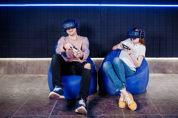 young guy and girl play in a virtual reality helmet  - Valokuva, kuva