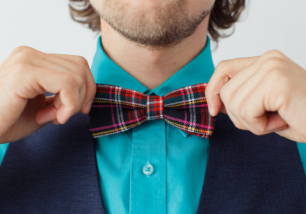 Young man in green shirt with beard in a bowtie - Photo, image