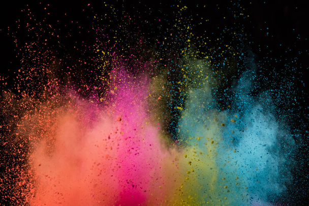Colored powder explosion on black background. - 写真・画像