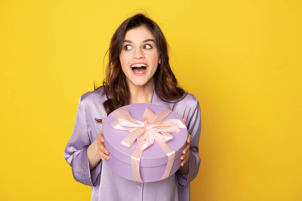 Happy excited girl holding festive present box - Foto, Imagem