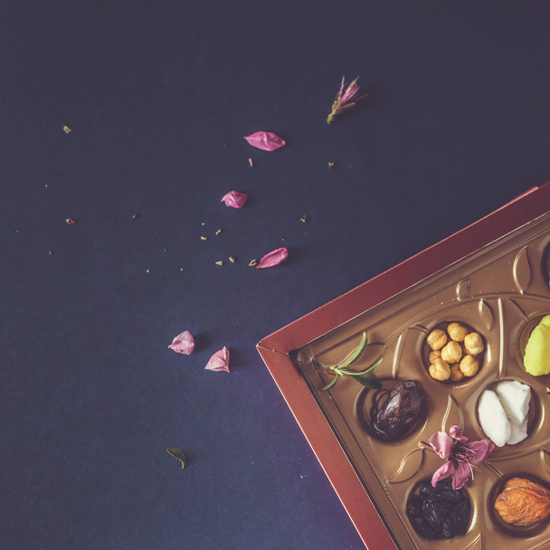 Eid Mubarak. Different iftar sweets. Celebrating Eid Al Adha. Islamic traditional holiday. Eid al-Fitr. Holly month Ramadan. Middle Eastern religious holiday. Dried date fruit. Flat lay, top view. - 写真・画像