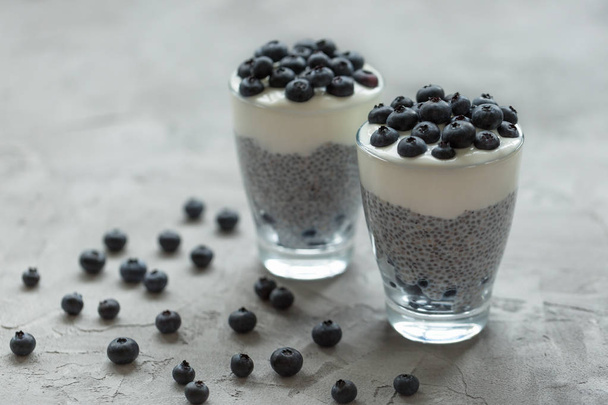 Chia pudding with almond milk, yogurt and blueberries dessert. V - Photo, Image