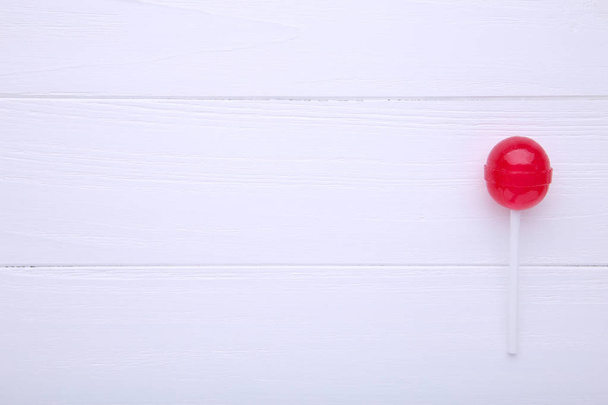 Sweet red lollipop on white background. sweet candy concept - Foto, imagen