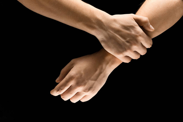 Male hands demonstrating a gesture of getting touch isolated on gray background - Foto, Imagem