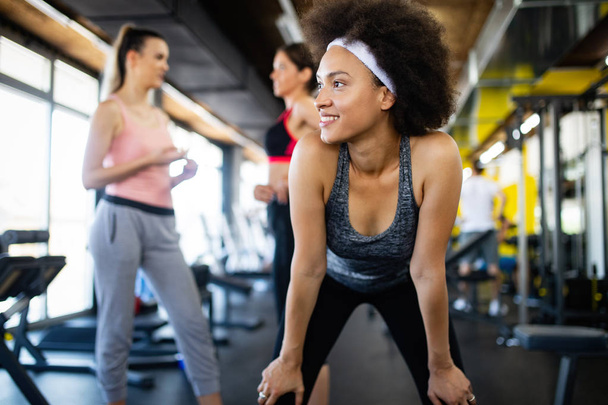Fit sportswomen exercising and training in gym - Zdjęcie, obraz