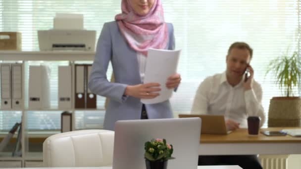 Professional young muslim business woman looking at camera laughing - Video