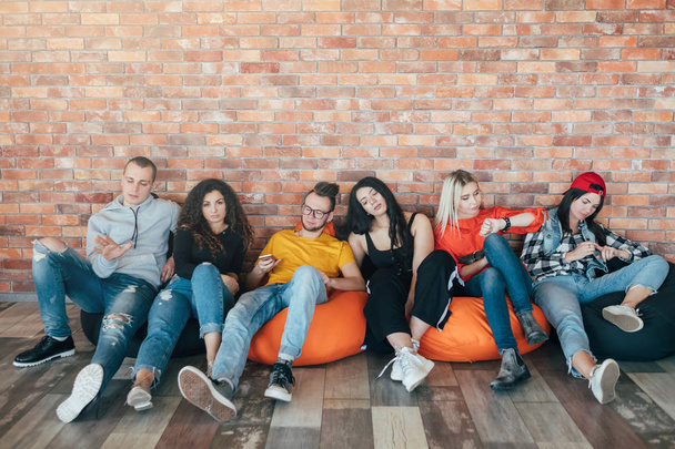 millennials sitting resting lounge zone bored - 写真・画像