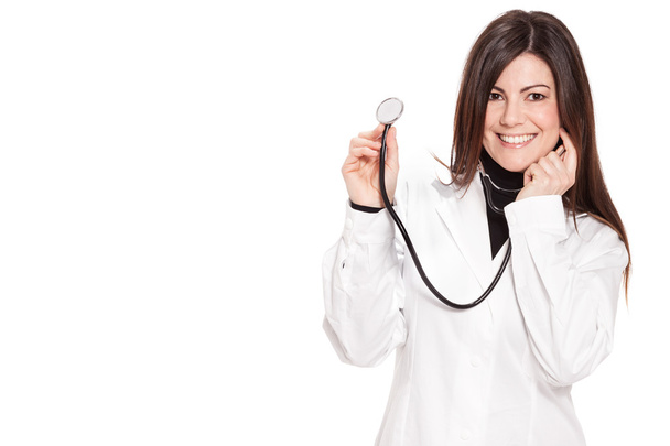 Attractive female doctor over white isolated background - Foto, Imagen