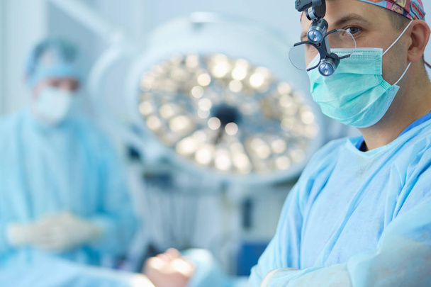 Male surgeon on background in operation room - Φωτογραφία, εικόνα