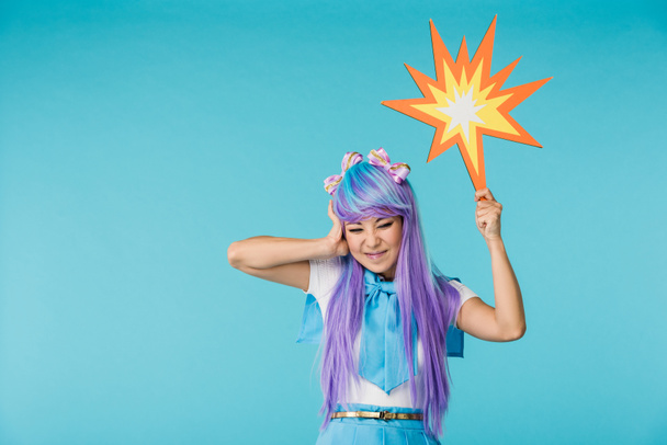 Irritated asian anime girl in wig posing on blue - Foto, immagini