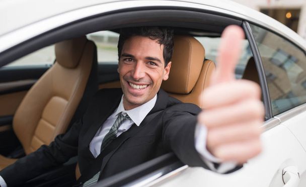 Car driver showing thumbs up - Photo, image