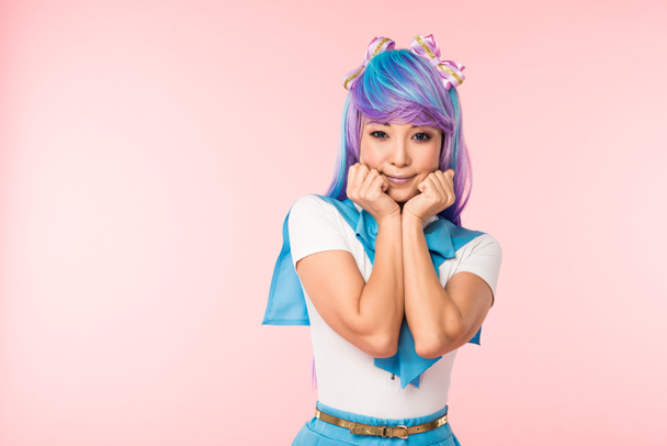 Pretty asian anime girl in purple wig posing isolated on pink - Photo, Image