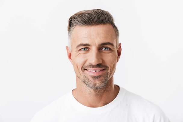 Image of successful man 30s with bristle wearing casual t-shirt  - Fotografie, Obrázek