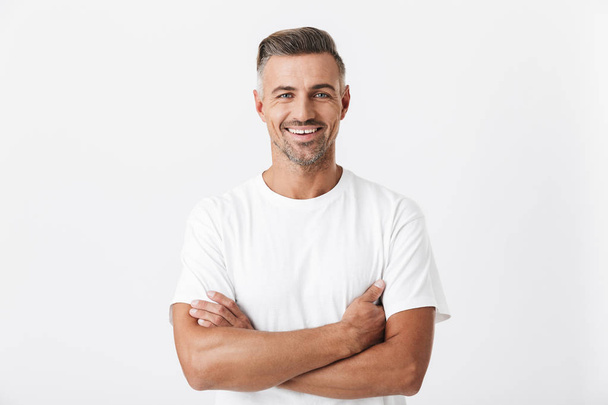 Image of optimistic man 30s with bristle wearing casual t-shirt  - Foto, Bild