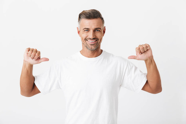 Image of joyful man 30s with bristle wearing casual t-shirt poin - Foto, Imagem