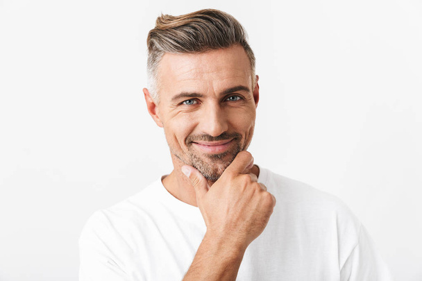 Image of optimistic man 30s with bristle wearing casual t-shirt  - Fotografie, Obrázek