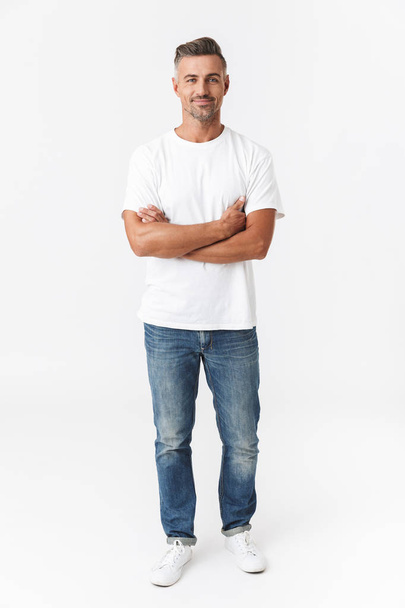Full length image of handsome man 30s wearing casual t-shirt and - Фото, изображение
