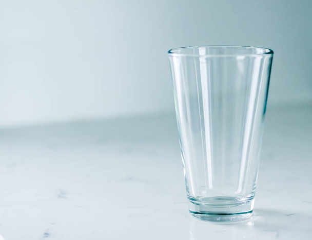 Clean empty glass on marble table - 写真・画像