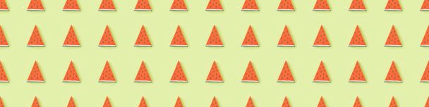 panoramic shot of pattern with handmade paper watermelon slices isolated on green - Zdjęcie, obraz