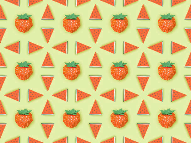 top view of pattern with handmade red paper strawberries and watermelon slices isolated on green - Foto, immagini