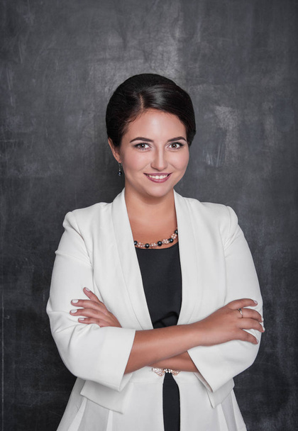 Beautiful business woman smile on blackboard background - Photo, Image