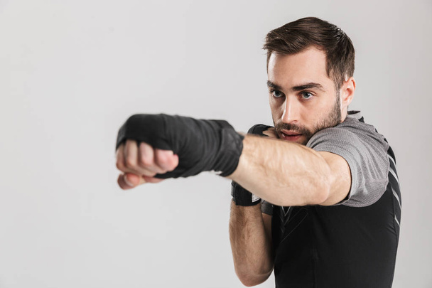 Sports fitness man boxer isolate over white wall background make exercises. - Fotó, kép