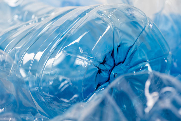 Clear transparent blue plastic containers being issue for nature and environment - Fotografie, Obrázek