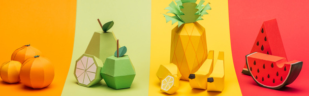 panoramic shot of various handmade origami fruits on stripes of colorful paper - Foto, Imagem