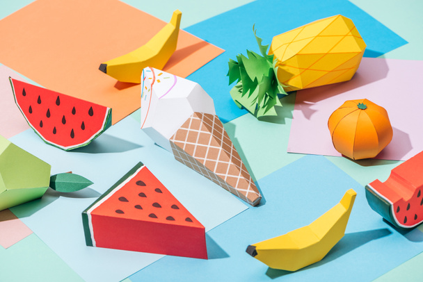 origami ice cream and handmade cardboard fruits on multicolored paper - Foto, Imagem