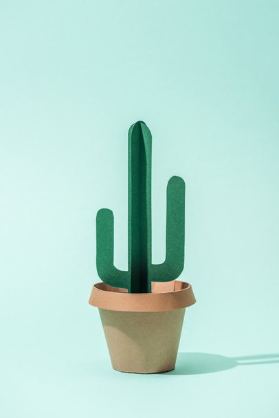 handmade green paper cactus in flower pot on turquoise - Фото, изображение
