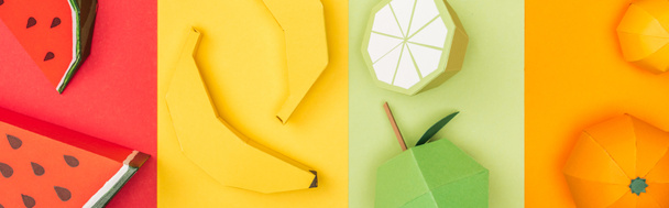 plano panorámico de sandías de origami, plátanos, mandarinas y lima sobre papel a rayas de colores
 - Foto, Imagen